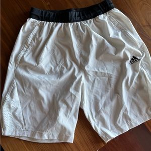 Adidas size M white workout shorts . Pockets have zippers. Drawstring